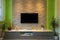 Modern living room interior - tv mounted on brick wall with black screen and ambient light