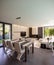 Modern living room overlooking the garden and swimming pool.