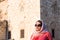 Modern Lookalike Muslim Woman With Scarf and Sunglasses Posing in Front of the Mosque