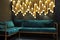 Modern lounge bar interior.Dark tone.Dark cyan sofa .Golden laterns in form of tubes