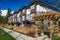 Modern low rise wood frame complex. Brand new apartment building on sunny day in spring with blooming trees.