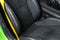 Modern Luxury car inside. Interior of prestige modern car. Comfortable leather seats. Black perforated leather with yellow s