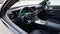 Modern luxury supercar interior, black leather seats, modern multimedia, virtual dashboard