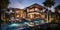 Modern luxury villa, rich mansion with pool in night lights in summer