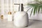 Modern marble soap dispenser on table