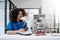 Modern medical research laboratory. female scientist working with micro pipettes analyzing biochemical samples, advanced science