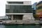 Modern Meridian Energy Building with louvre screen, seafront deck, stairs on water in North Kumutoto, Wellington CBD, New Zealand