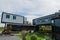 Modern metal building made from shipping containers and blue sky background