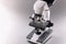 Modern microscope tool for laboratory research on grey background