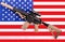 Modern military automatic carbine M4A1 against the background of the American flag. Machine gun on the flag mount.Modern automatic
