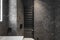 Modern minimalist bathroom dark interior design with dark stone tiles