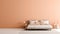 Modern minimalist bedroom interior with soft peach fuzz color empty wall with copy space for text