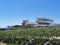 Modern Minimalistic Architecture Across a Field and Blue Sky