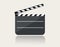 Modern movie clapper icon with reflection on ground