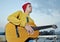 Modern musician posing with his guitar