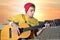 Modern musician posing with his guitar