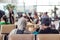 Modern muslim islamic asian couple sitting and waiting for flight departure at international airport terminal