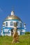 Modern neo pagan symbolic sculptures, symbolizing forces of nature with modern russian orthodox church in background