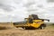 Modern New Holland combine harvester cutting crops