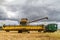 Modern new holland combine harvester cutting crops
