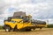 Modern new holland combine harvester cutting crops