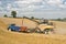 Modern New Holland combine harvester cutting crops