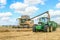 Modern New Holland combine harvester cutting crops