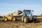 Modern New Holland tractor Tractor being loaded up with muck for muck spreading