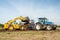 Modern New Holland tractor Tractor being loaded up with muck for muck spreading