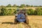 Modern New Holland tractor Tractor spreading manure on fields