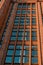 Modern office building, detailed view of finance house windows. Pattern. Office building, blue glass wall reflection detail. Clear