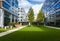 Modern office park with green lawn, trees and bench