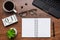 Modern office workplace with laptop keyboard, coffee cup, smart phone, stationery and plant. Date 01 March on wooden block