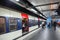 Modern Parisian subway station with passengers