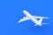 Modern passenger airplane on blue background. Charter flights. Air transportation