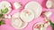 Modern pastel pink tableware on pink background. Creative concept layout.