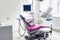 Modern patient chair and equipment in dentistry office