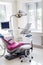 Modern patient chair and equipment in dentistry office