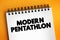 Modern pentathlon - Olympic sport that comprises five different events, text concept on notepad