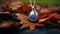 Modern Photography: Gold Necklace With Dark Lapis Pendant On Fall Leaves