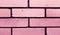 Modern pink brick wall texture or background. Cleaned structure of brickwork. Copy space