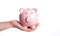 Modern Pink Piggy Bank in Child\\\'s Hand AI Generated