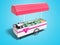 Modern pink portable refrigerator for sale of ice cream on the street perspective view 3d render on blue background with shadow