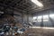 Modern plant processing and sorting urban waste - evening sunlight in huge reception junkyard room hangar for unloading waste from