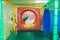 Modern playground indoor. Kids jungle in a play room. Round tunnel in children gym.