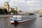 Modern pleasure boat sails along the Moscow River.