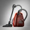 Modern powerful burgundy vacuum cleaner with an orange bumper