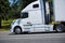 Modern powerful leader semi truck profile white nice road