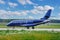 A modern private business jet in dark blue is preparing for takeoff. Travel or business trips on a private plane. Jet