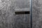 Modern profile door with handle upholstered in gray velor fabric. Modern trends in decor and interior design. Close-up